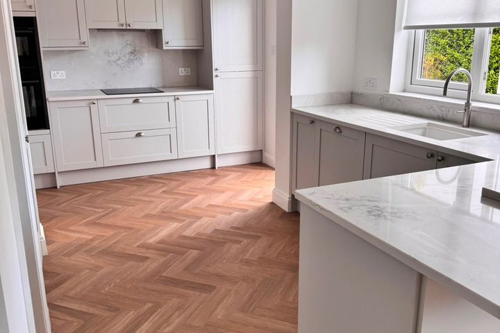 Renovated kitchen with herringbone flooring