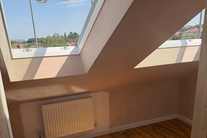 Finished loft room with two large rooflights and oak flooring