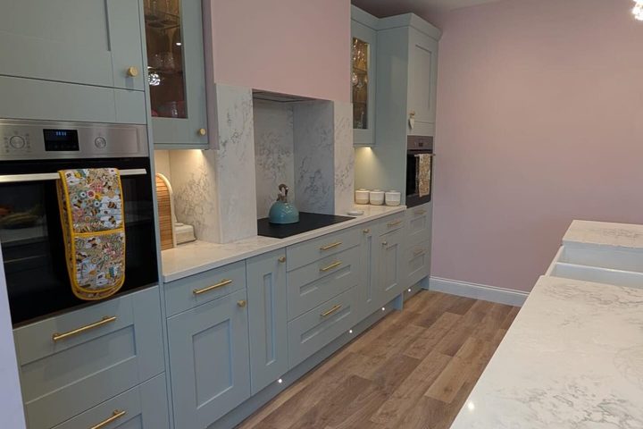 Glazed cabinet doors with brass handles