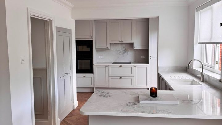 Renovated shaker kitchen with herringbone parquet