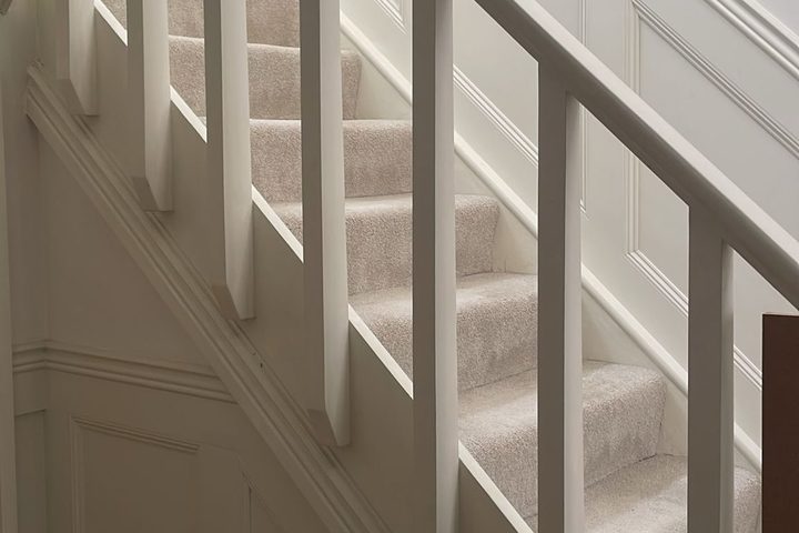 Renovated staircase with painted wall panelling